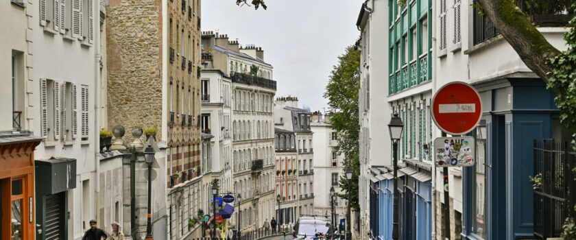 Explore the charming streets of Montmartre, Paris with its classic European architecture and vibrant city life.